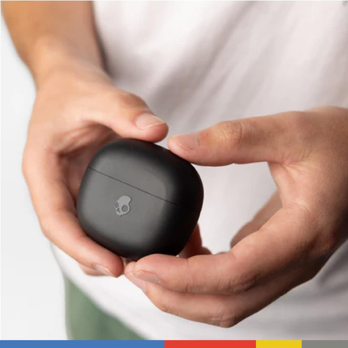 Skullcandy Rail next to a phone and keys to show compact size and portable charging benefit