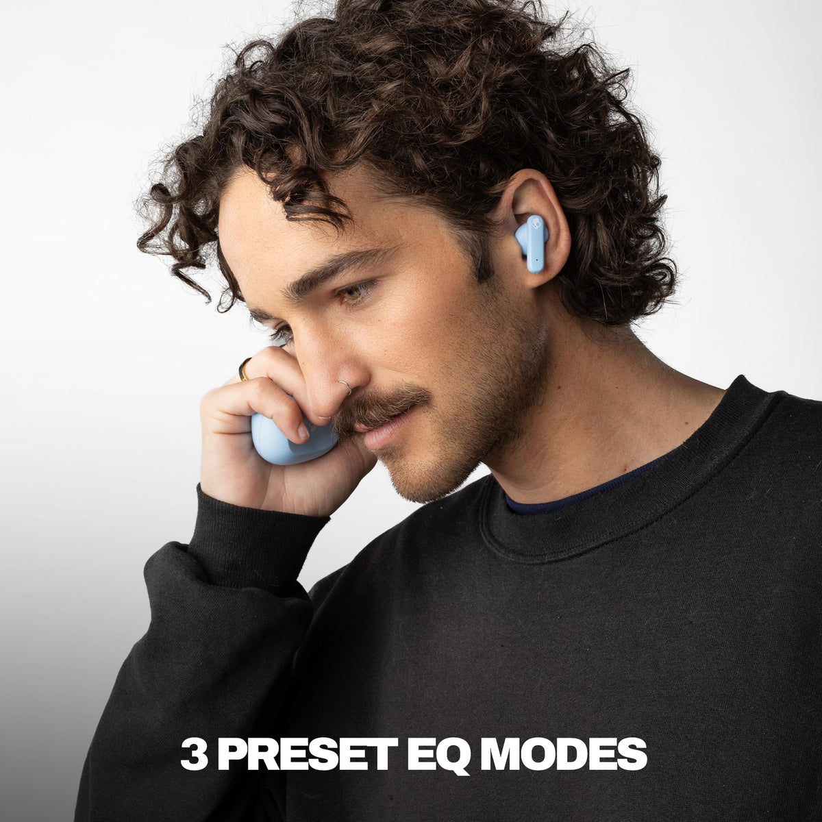 Skullcandy Smokin’ Buds charging case open displaying earbuds and battery indicator for long playtime