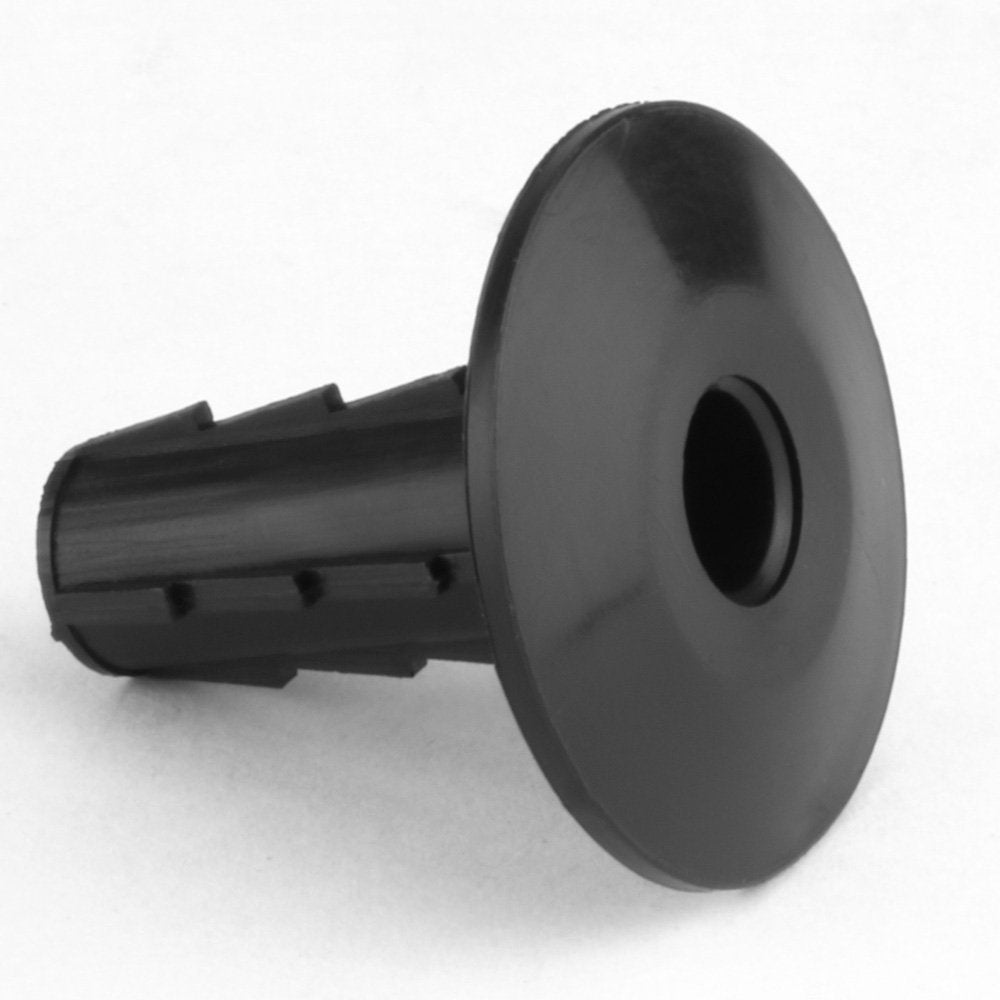 Skywalker bushing beside a quarter for scale, demonstrating compact size and easy installation