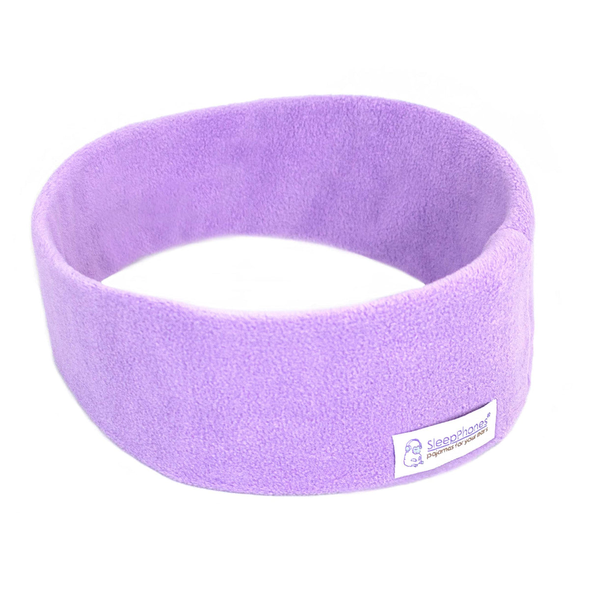 SleepPhones wireless headphones on a bed with cozy lavender fleece for night listening