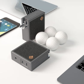 SlimQ lightweight, travel-compact charger displayed as a portable desk setup.