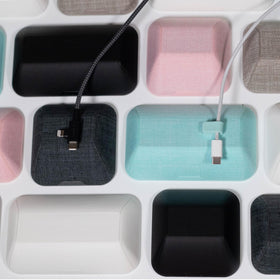 Smartish next to a pencil showing compact scale for space-saving benefit