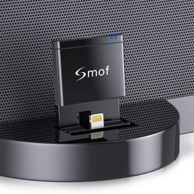 Smof 8-pin Bluetooth adapter on a dock enabling wireless music streaming.