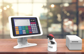 Socket Mobile dock on retail counter with scanner docked, keeps workspace tidy and reduces cable clutter
