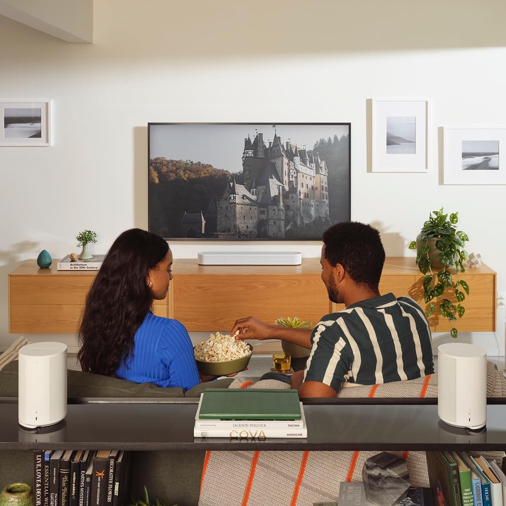 Sonos Beam Gen 2 white TV setup with remote for easy control.