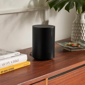 Sonos Era 100 on a shelf illustrating compact, space-saving design