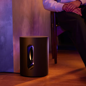 Sub Mini placed near a wall for compact, powerful bass
