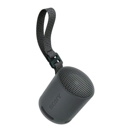 Sony SRS-XB100 with charging cable stored in case pocket for tidy travel