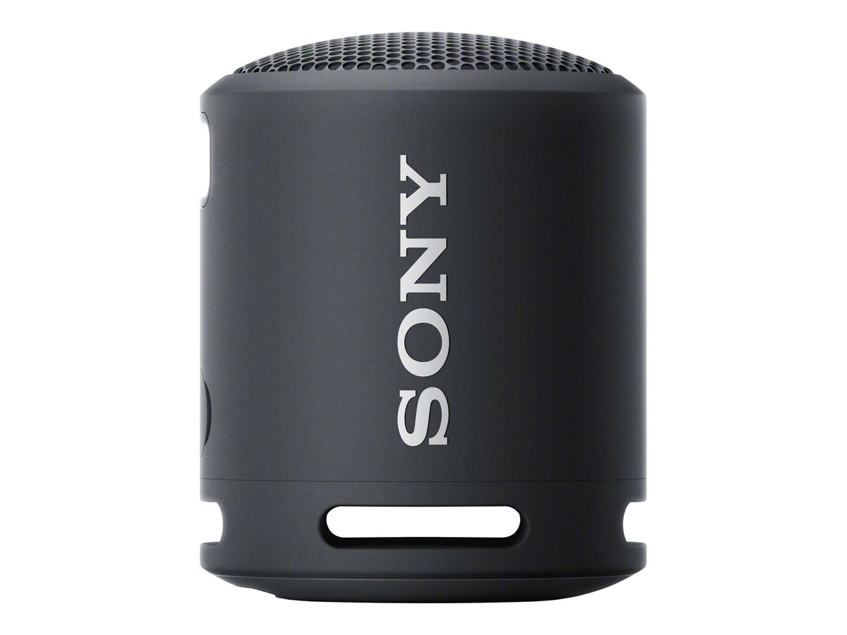 Sony SRS-XB13 next to a hand demonstrating compact size and pocketability