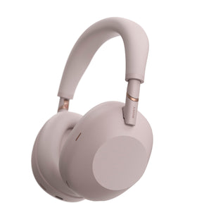 Sony WH-1000XM6 headphones on ear with sand pink finish for immersive listening