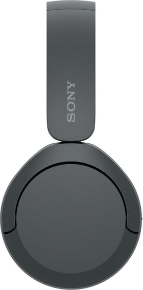 Sony WH-CH520 folded in hand illustrating compact, travel-ready size