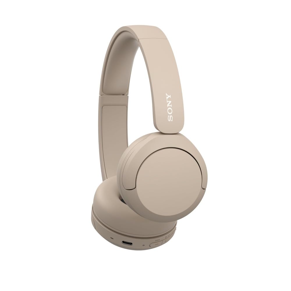 Sony WH-CH520 held in hand to show size and lightweight portability benefit