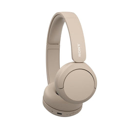 Sony WH-CH520 held in hand to show size and lightweight portability benefit