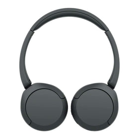 Person wearing Sony WH‑CH520 on commuter train for comfortable all‑day use