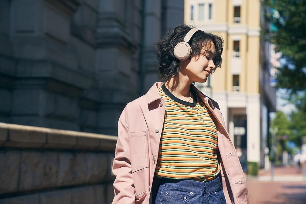 Sony WH-CH520 on commuter in a lifestyle scene showing long battery life for travel benefit