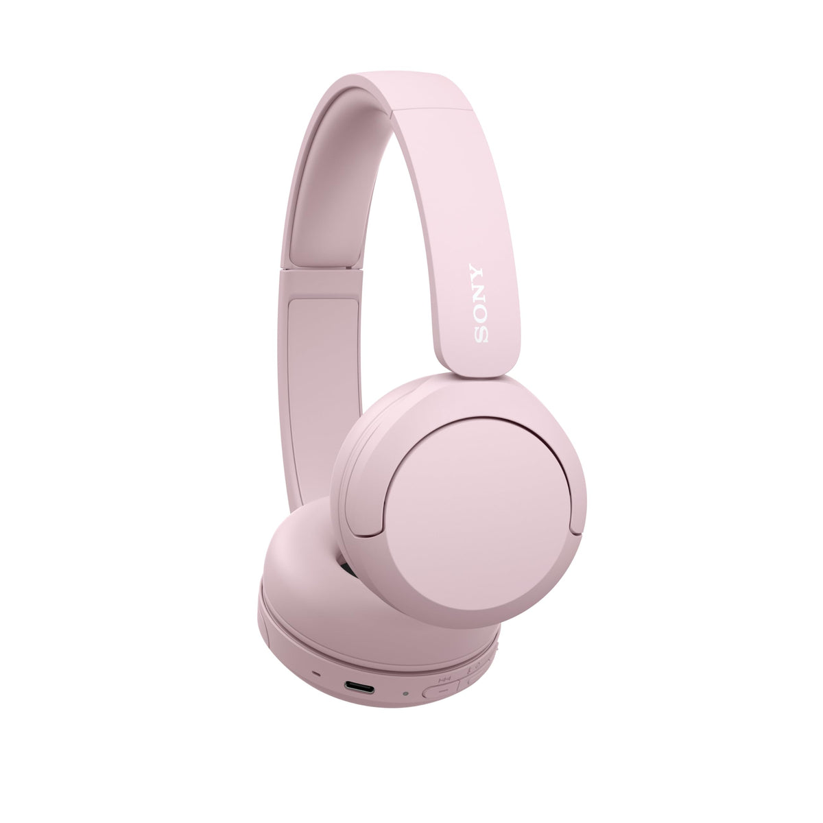Sony WH-CH520 pink in hand for size scale and travel-friendly benefit