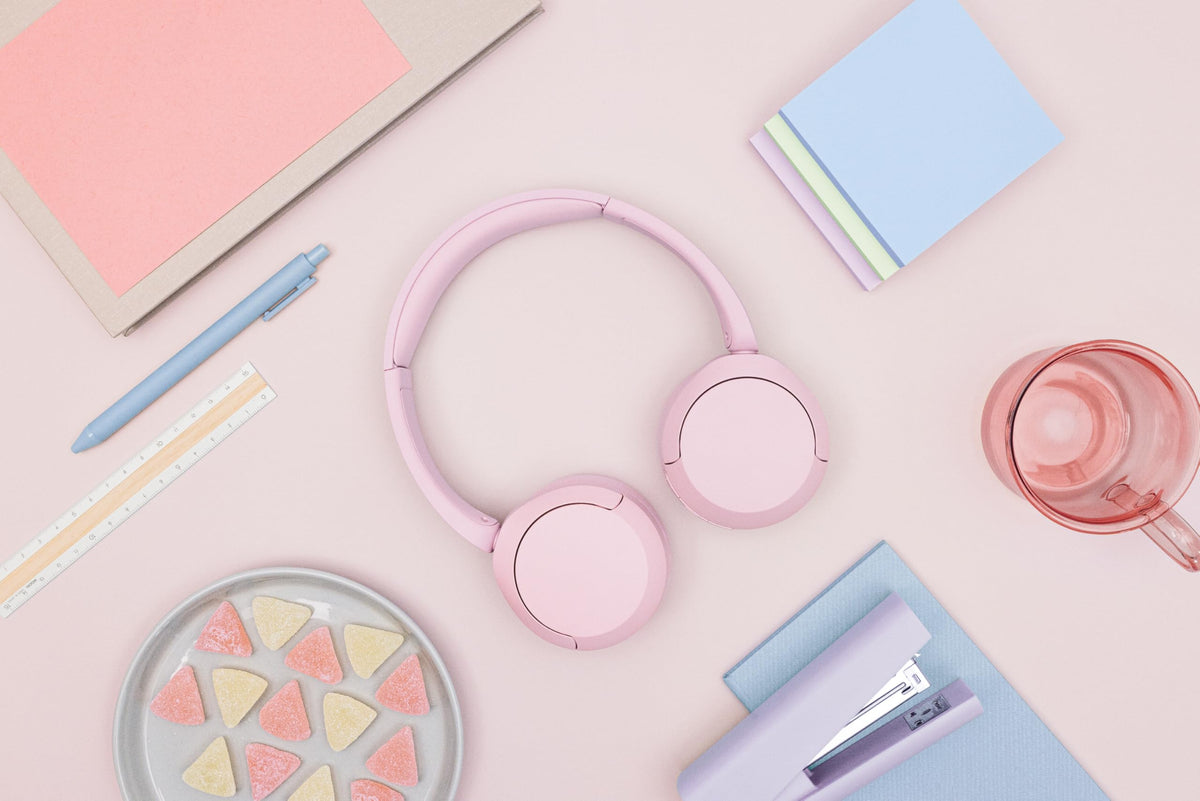 Sony WH-CH520 pink on head lifestyle showing comfortable all-day wear