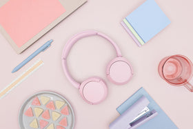 Sony WH-CH520 pink on head lifestyle showing comfortable all-day wear