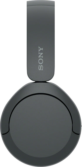 Sony WH-CH520 worn on commuter demonstrating lightweight portability benefit