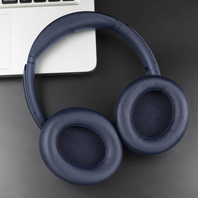 SOULWIT headphones with blue earpads on desk lifestyle shot showing comfort benefit