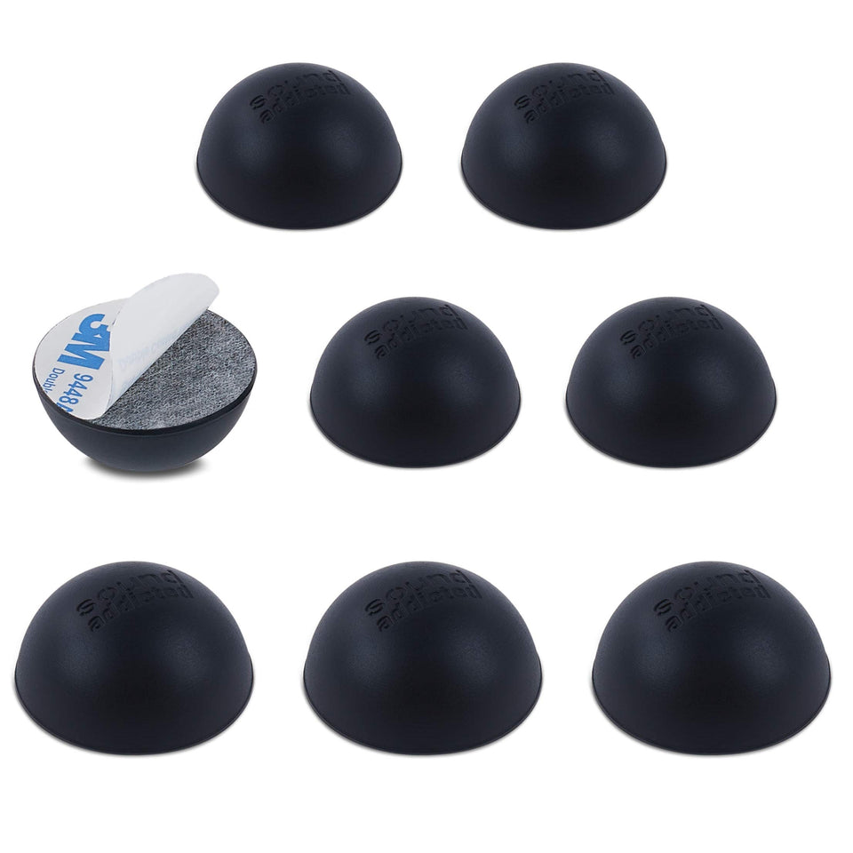 Sound Addicted Subble 1.2 inch isolation feet pack under a speaker for vibration reduction.