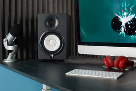 Sound Addicted Subble on a studio desk with monitors showing clearer nearfield sound
