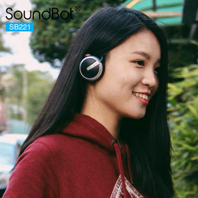 Soundbot SB221 beside smartphone showing Bluetooth pairing and range benefit