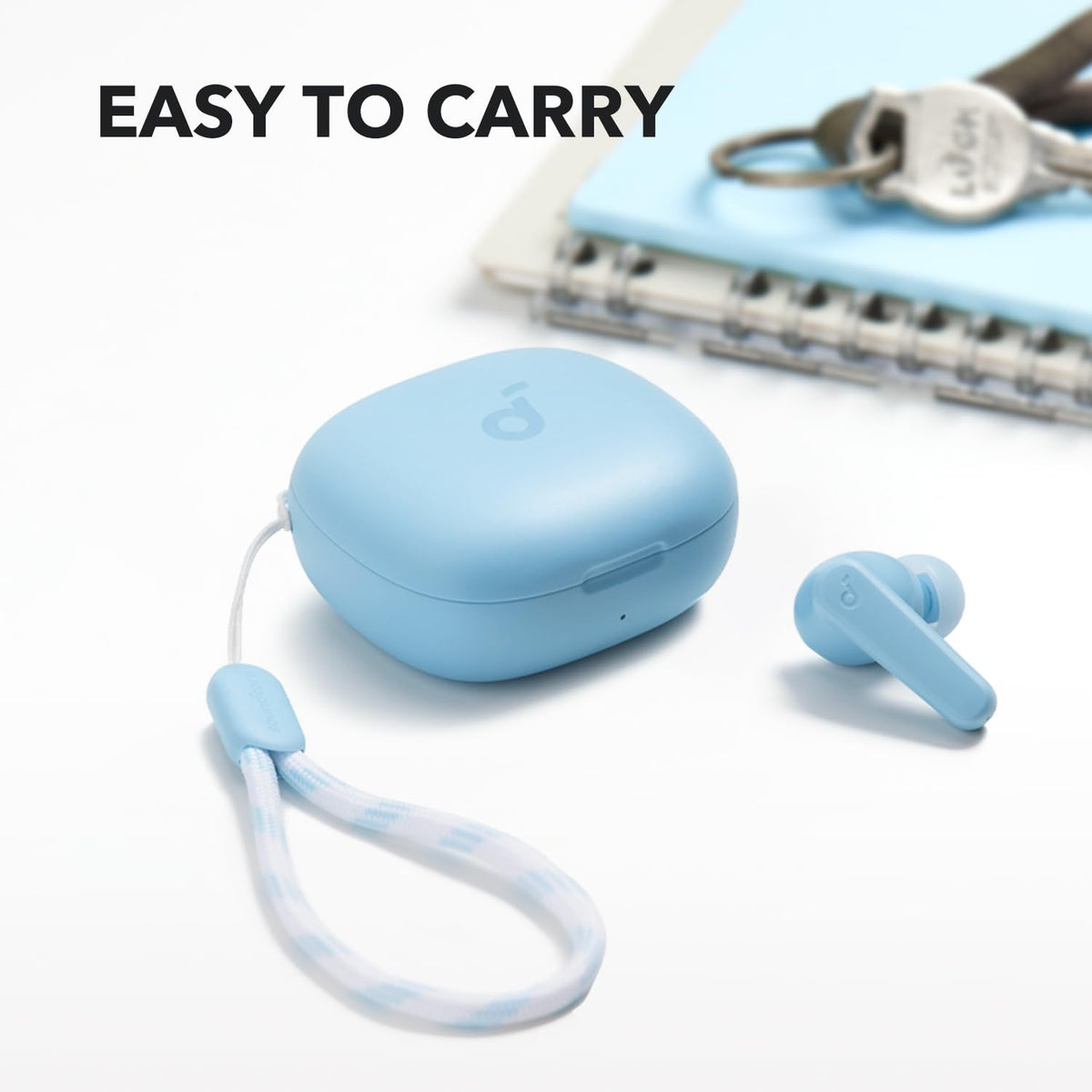 Soundcore P20i with attached lanyard clipped to bag, showing travel convenience