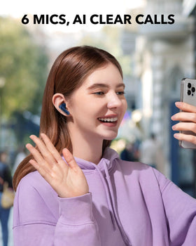 Soundcore P40i beside a coin for scale, emphasizing compact portable size