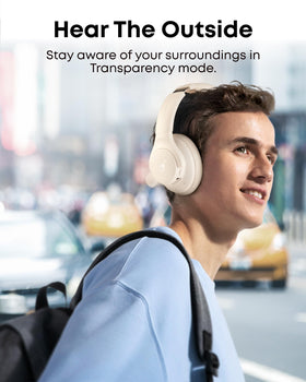 Person wearing Soundcore Q20i on a train illustrating noise cancellation benefit