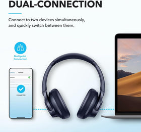 Hand holding Soundcore Q20i to show scale and portable convenience