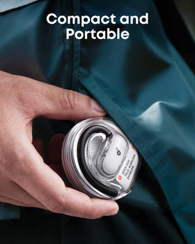 Soundcore V40i next to a hand to show compact portable scale