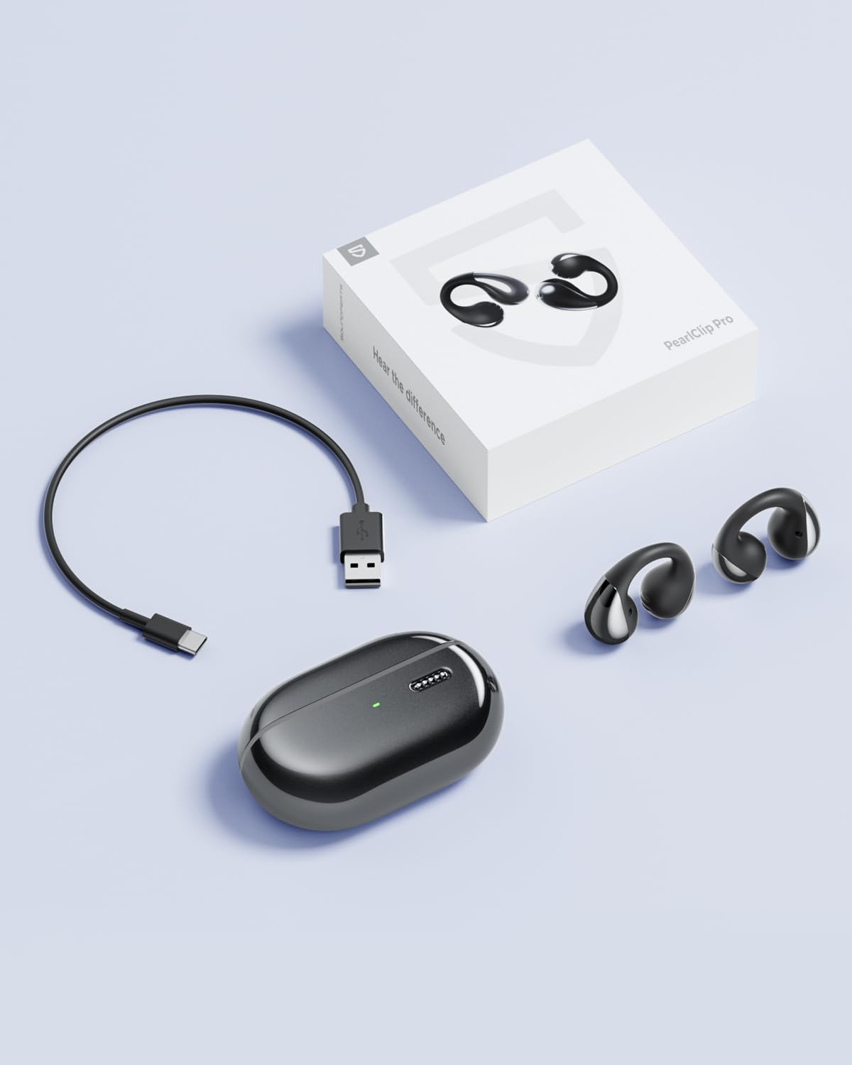 SoundPEATS box contents laid out showing case, earbuds, and cables
