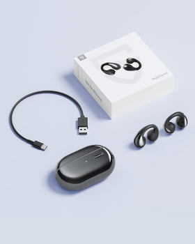 SoundPEATS box contents laid out showing case, earbuds, and cables