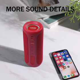 SOWO on table beside phone showing Bluetooth pairing and seamless playback