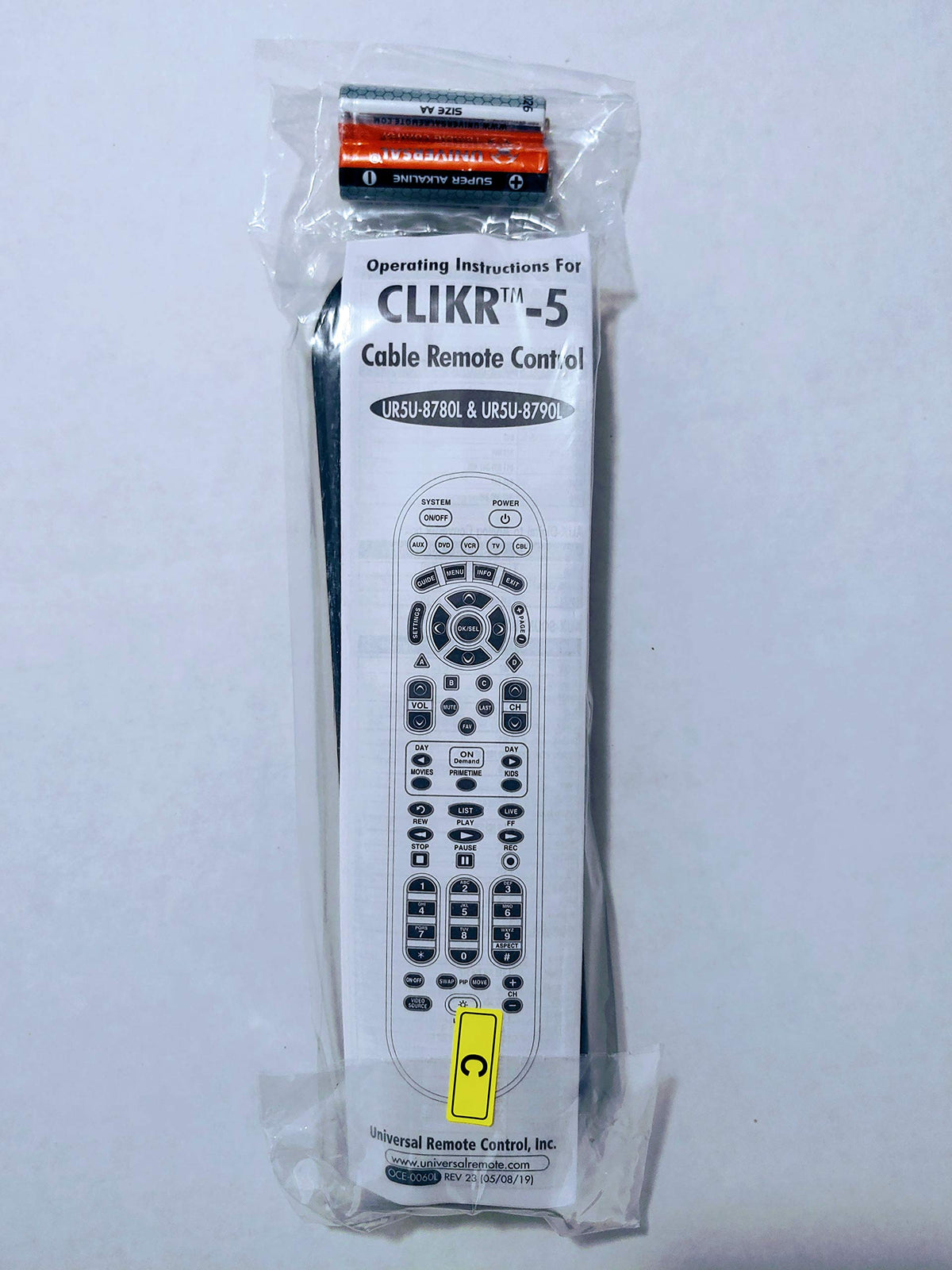 Spectrum TV remote in hand scale demonstrating ergonomic grip and quick access