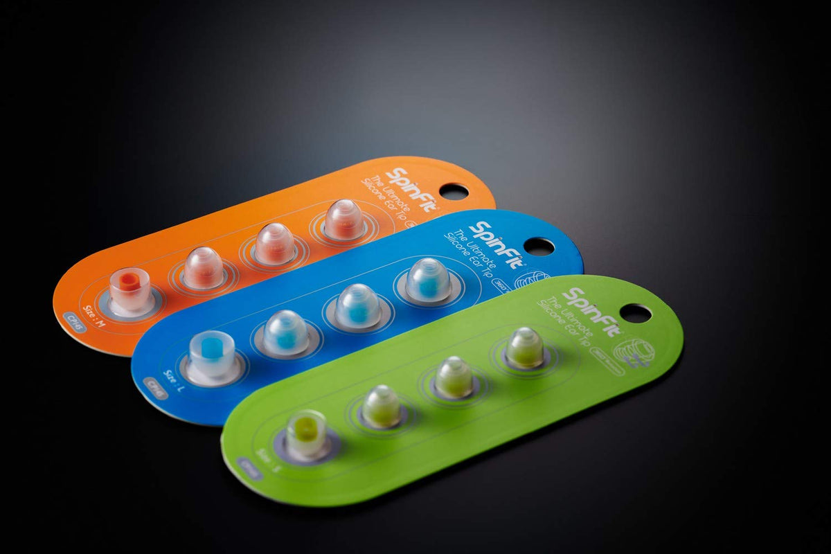SpinFit CP145 next to a coin showing size comparison for easy fit assessment