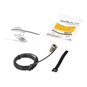 StarTech.com lock next to laptop showing scale and compatibility benefit