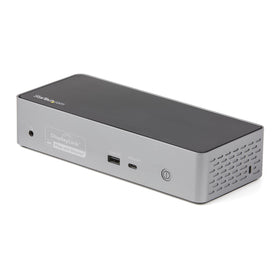 StarTech.com USB-C Quad Dock with MacBook setup enabling extended multi-monitor workspace.
