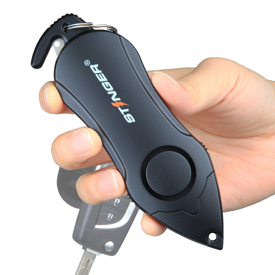 Stinger personal alarm keychain with 140 dB siren for fast help in danger.