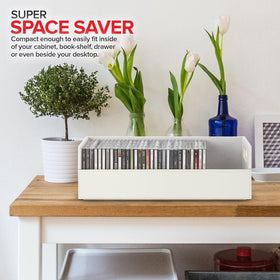 Stock Your Home boxes beside CD cases showing capacity and compact size advantage