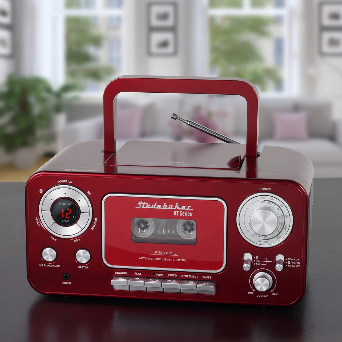 Studebaker portable boombox with handle carried outdoors showing easy transport benefit