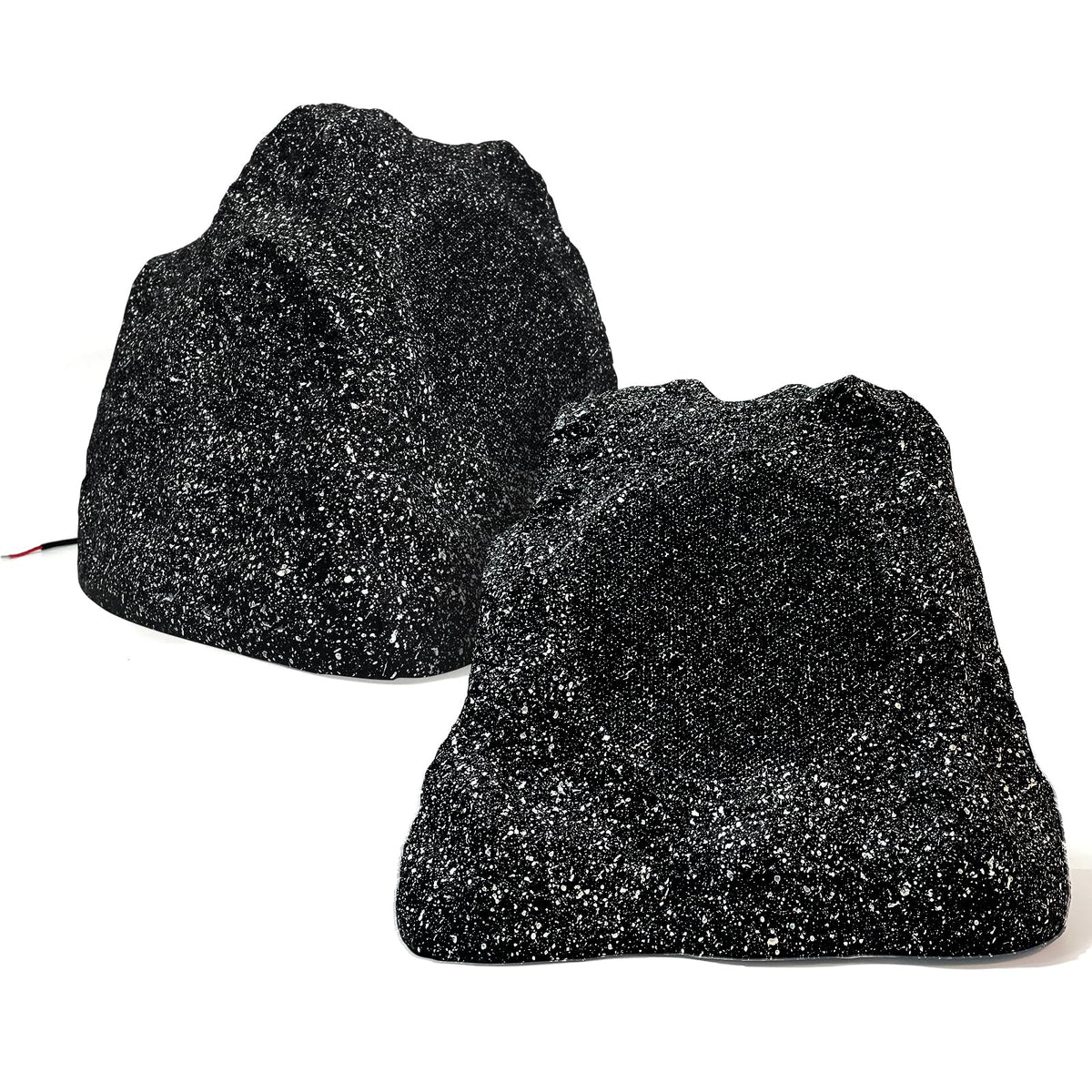 STUDIOFINIX outdoor rock speakers pair in garden setting deliver durable weatherproof sound for patios.