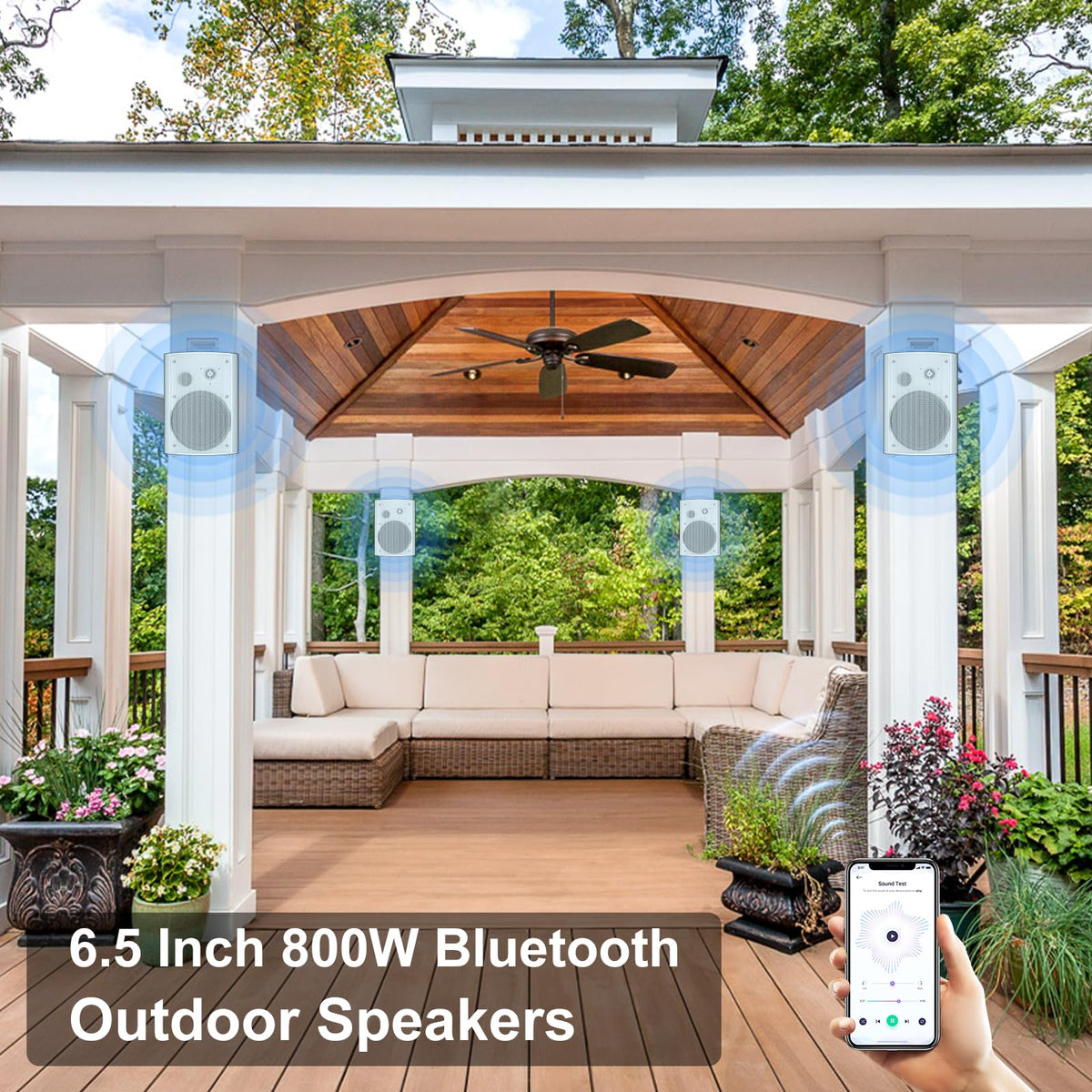 StudioFinix white outdoor speakers blending with garden decor and landscape