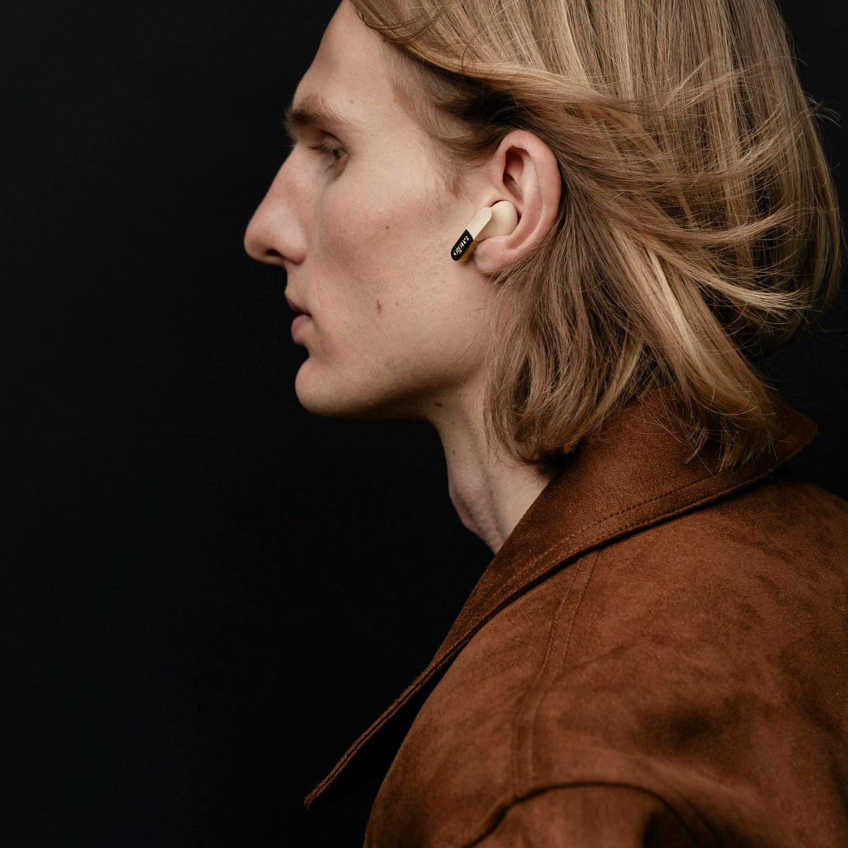 Sudio N3 earbud in ear during commute, clear sound and stable fit