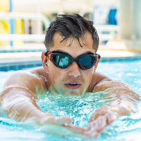 Swimbuds Flip worn by swimmer demonstrating low-drag waterproof performance