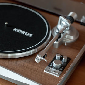 Syitren KORUS modern-classic design with wood grain texture and metallic accents.