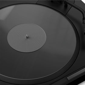 TAKMORK acrylic clear slipmat on a turntable for enhanced clarity.