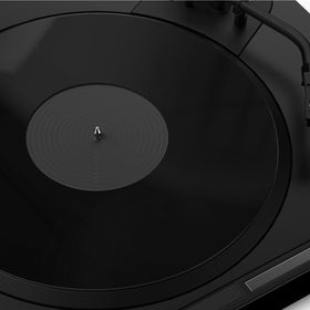 TAKMORK acrylic slipmat on a turntable improving bass tightness and quieter playback