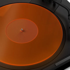 TAKMORK turntable mat in orange glow enhances aesthetic and stability.